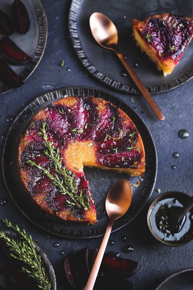 This tiny gluten free plum cake is laced with tangy lemon thyme syrup, and showcases jewelled plum tones in a delightful small batch autumn treat.